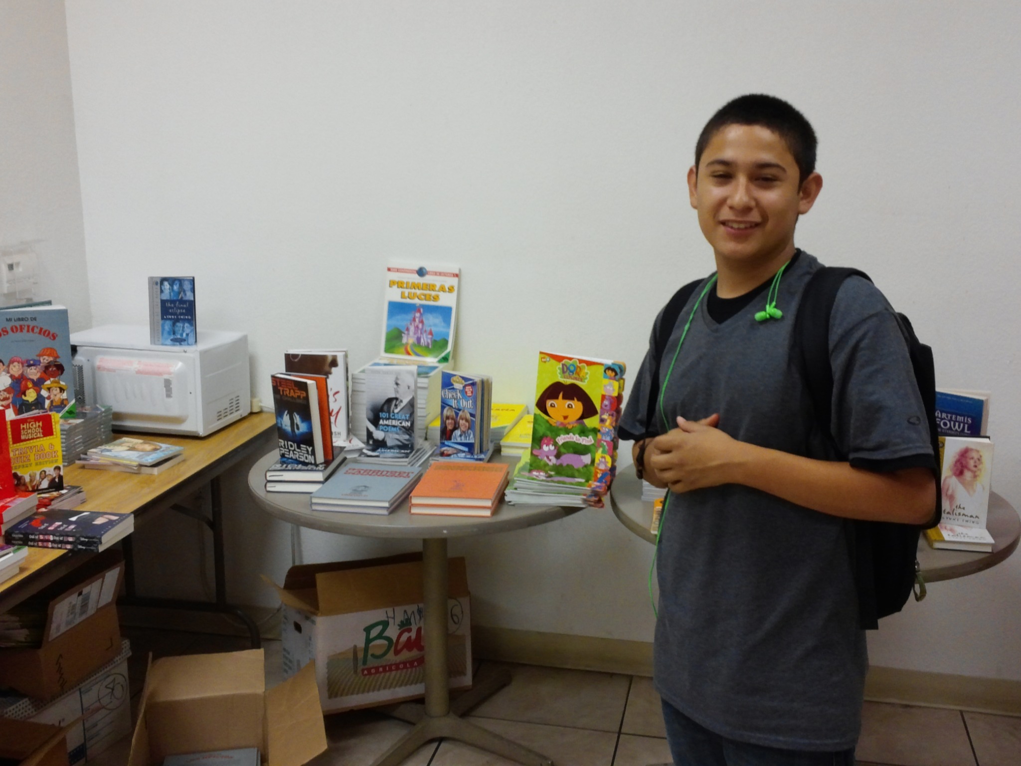 Harold standing near a display of books
